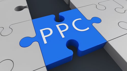 PPC on a blue puzzle piece to represent the difference between paid and organic search
