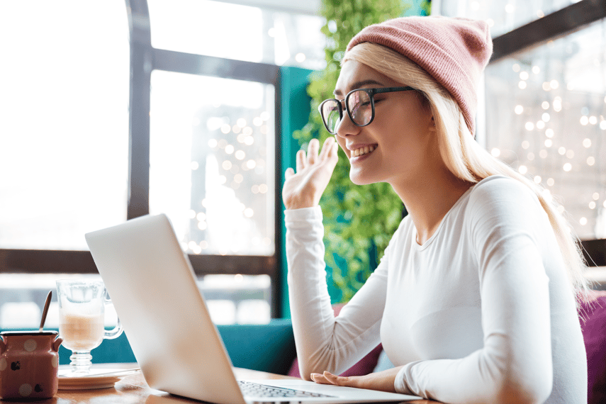 Smiling Woman Using Laptop to represent content optimisation