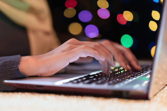 a close up of a woman on her laptop using chatspot ai