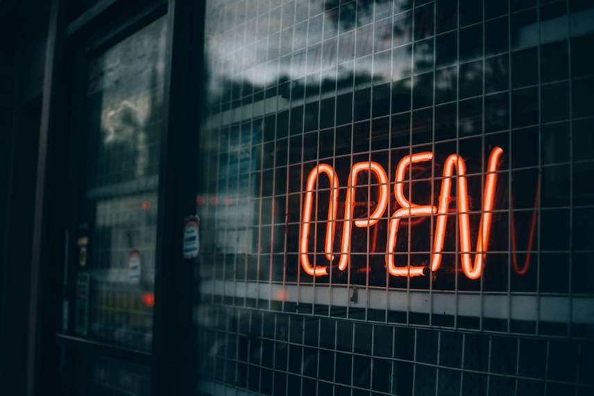 An orange neon open sign